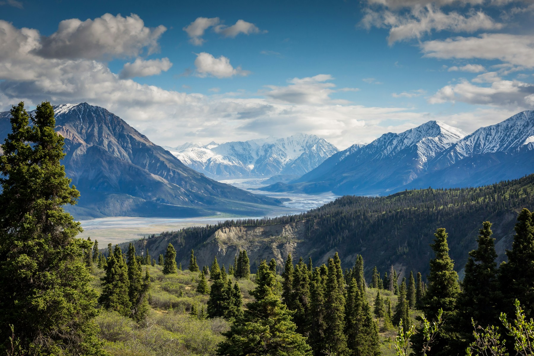 A rugged mountain ridge beneath a blue sky
